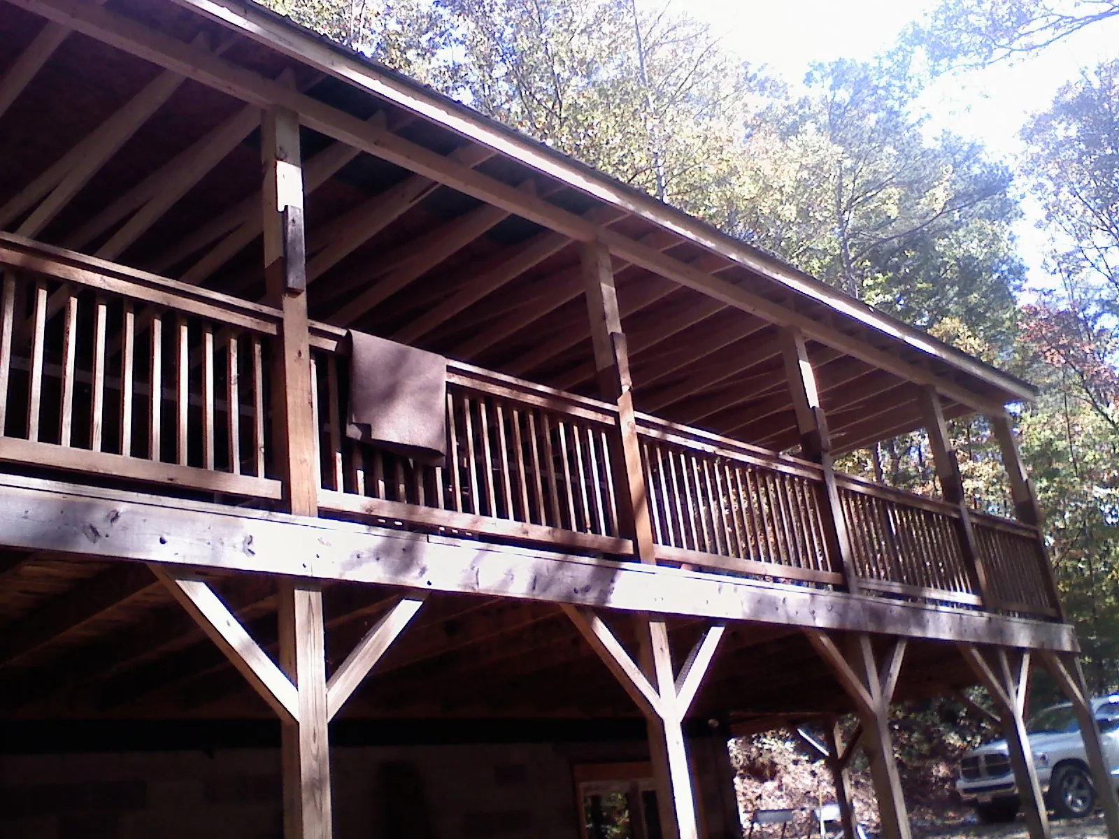 Timber framing under a new elevated porch and deck — Roof Leak Repair in Polson by Roofing Brothers